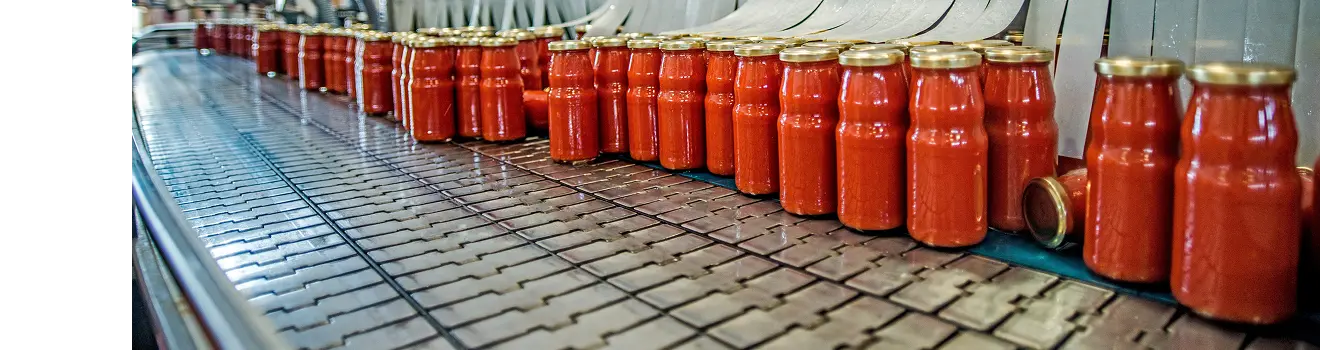 A row of red sauce food jars